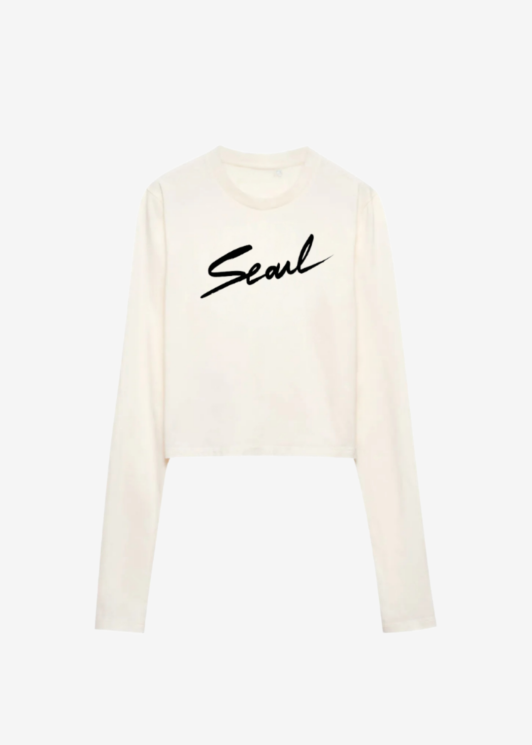 A cream long-sleeve crop top with the word 'Seoul' printed in black cursive.